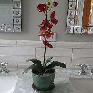 Pretty faux orchid in glass planter